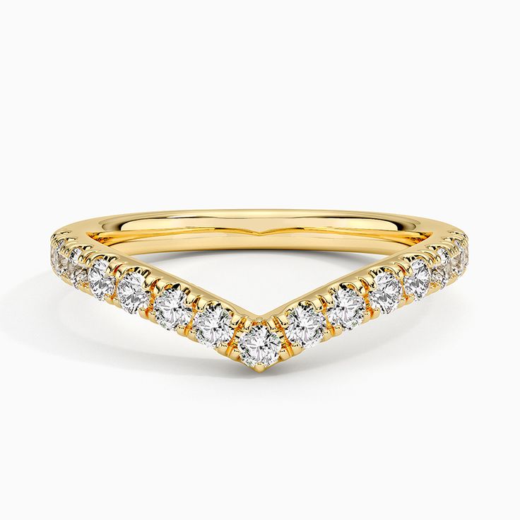 a yellow gold band with diamonds on it