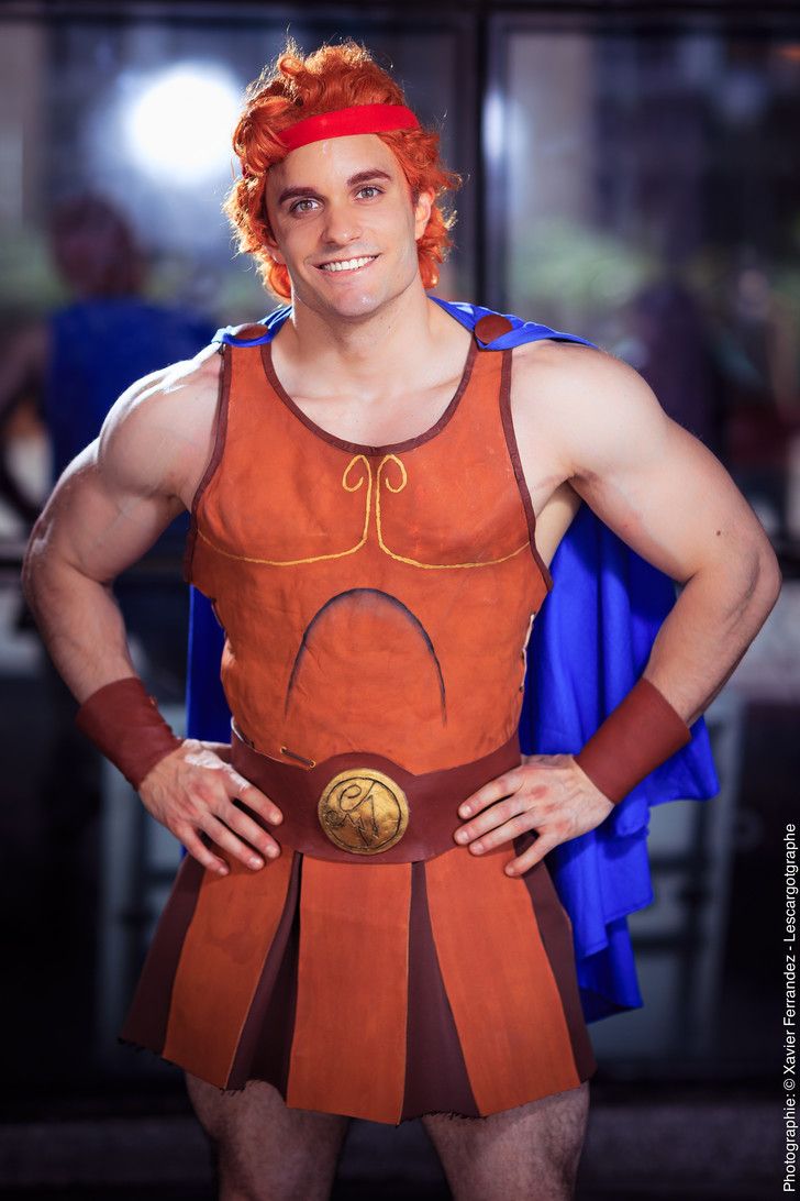 a man dressed as a roman soldier posing for the camera with his hands on his hips