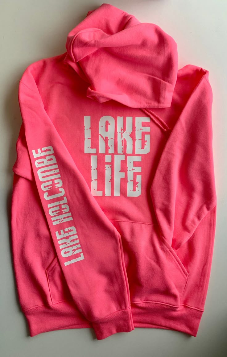 "\"Our SUPER popular Lake Life hoodie is now available in NEON colors!! (Color in main listing photo is Neon Pink.) \"Lake Life\" adult hoodie, customized with the lake name of your choice! These are navy in color with a distressed white font design on the front and down the arm. Extremely soft, like wearing a cozy blanket! Unisex, but fit true to size. ENTER THE ARM CUSTOMIZATION IN THE \"NOTE TO SELLER\" BOX DURING CHECKOUT (I've had lots of questions about this) and please feel free to send a Lake Vacation Shirt Ideas, Cricut Lake Shirts, Lake Clothes, Lake Wear, Lake Logo, Lake Sayings For Shirts, Lake Life Sweatshirt, Ski School, Lake Life Shirt