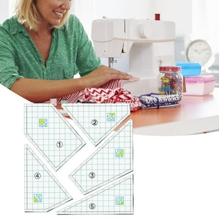 a woman sitting at a sewing machine working on a piece of paper that is cut into squares