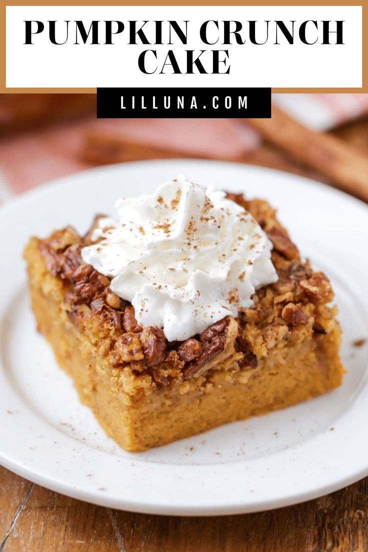 pumpkin crunch cake on a white plate with whipped cream