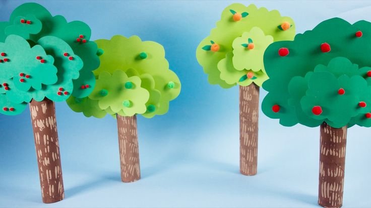 three trees made out of paper with red berries on the top and green leaves on the bottom