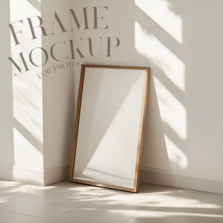 an empty wooden frame next to a white wall with the words frame mockup on it