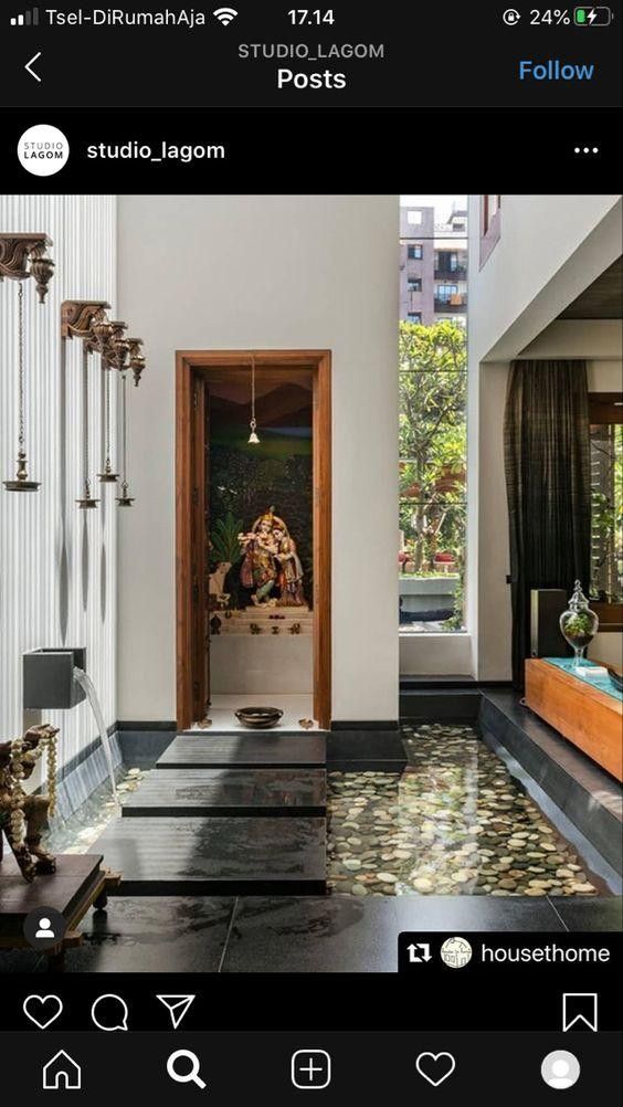 an open door leading into a room with black and white flooring on the walls