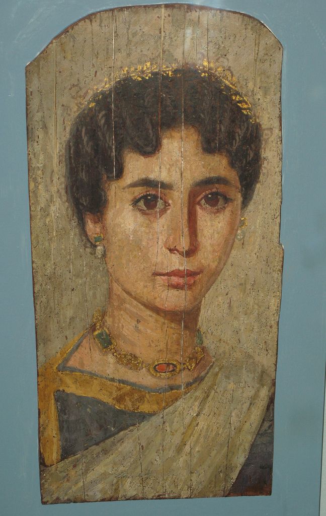 an old painting of a woman with black hair and wearing a gold necklace on her neck