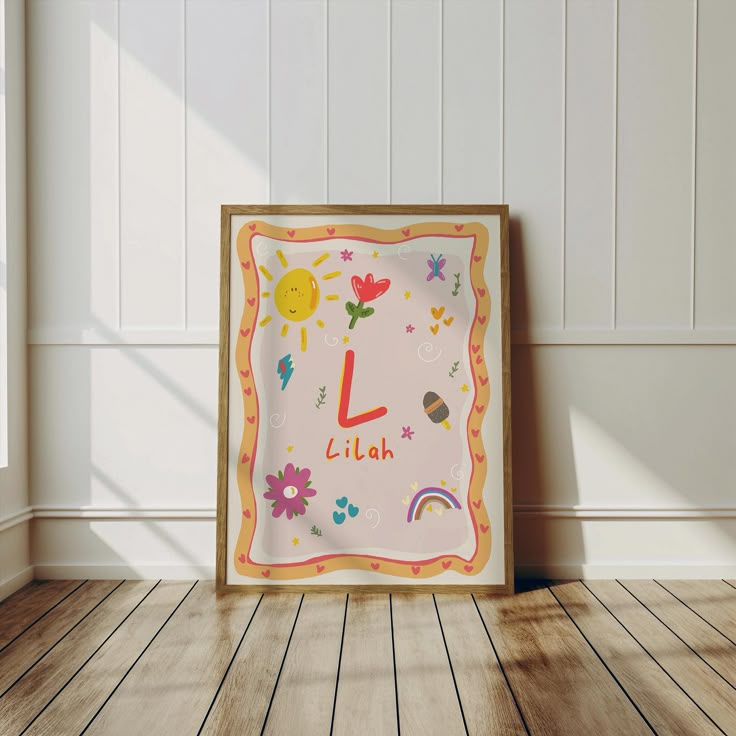 a wooden frame with the letter l on it sitting in front of a white wall