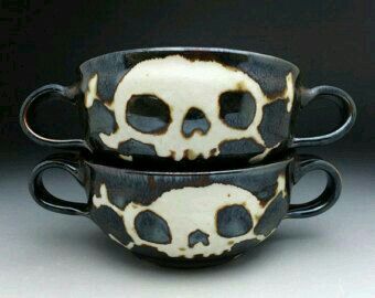 two black and white cups with skulls on them