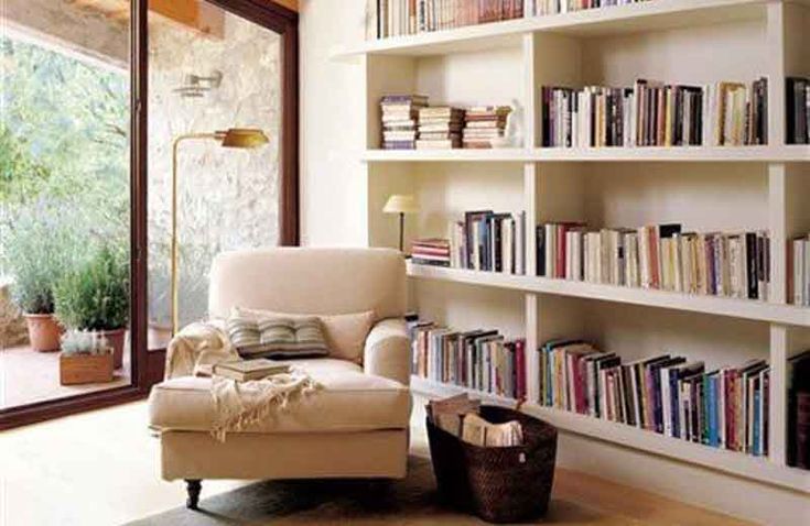 a living room filled with lots of books