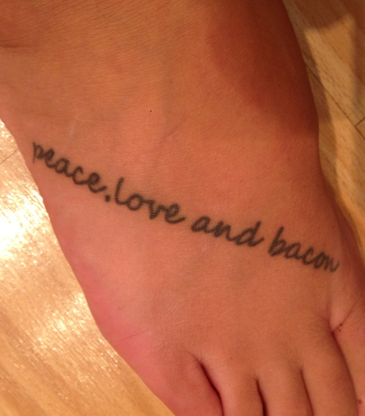 a person with a tattoo on their foot that says peace love and bacon