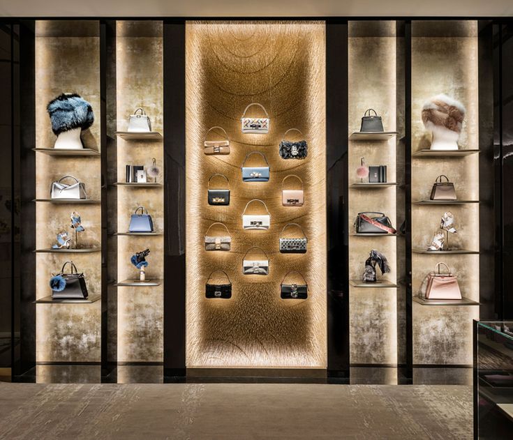 a display case filled with lots of different types of purses