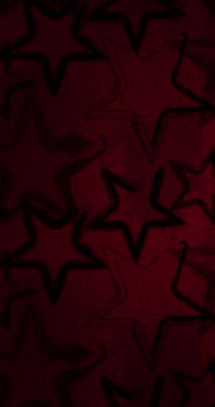 an abstract red background with black stars