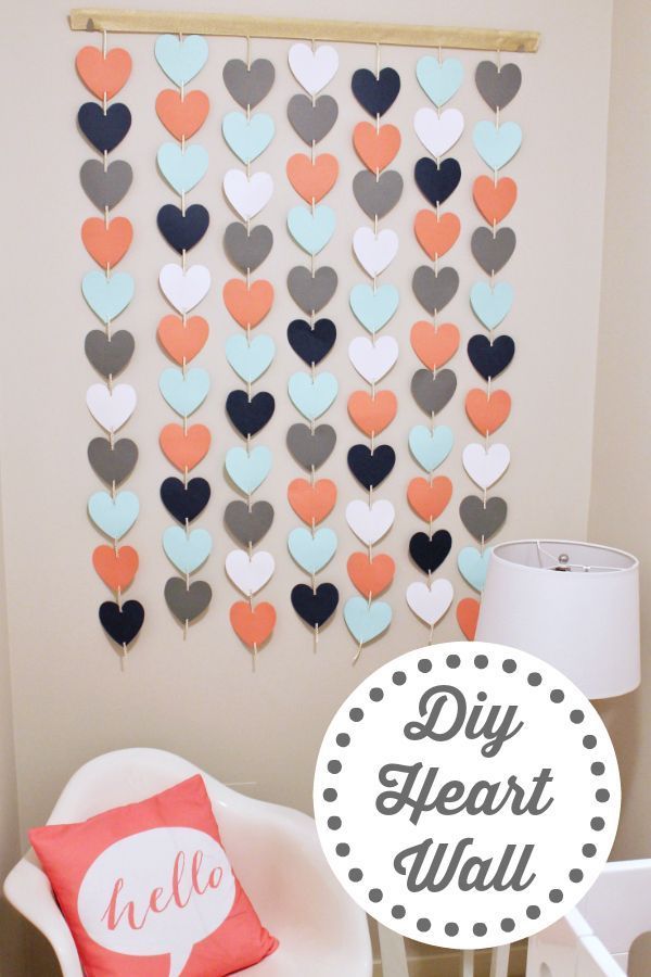 the diy heart wall is made with paper hearts