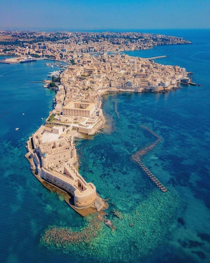 an aerial view of the old city and its surrounding coastlines in the middle of the ocean