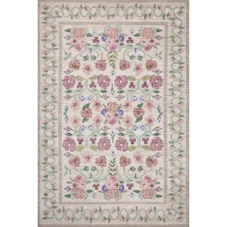 a white rug with pink flowers and leaves on the bottom, in front of a beige background