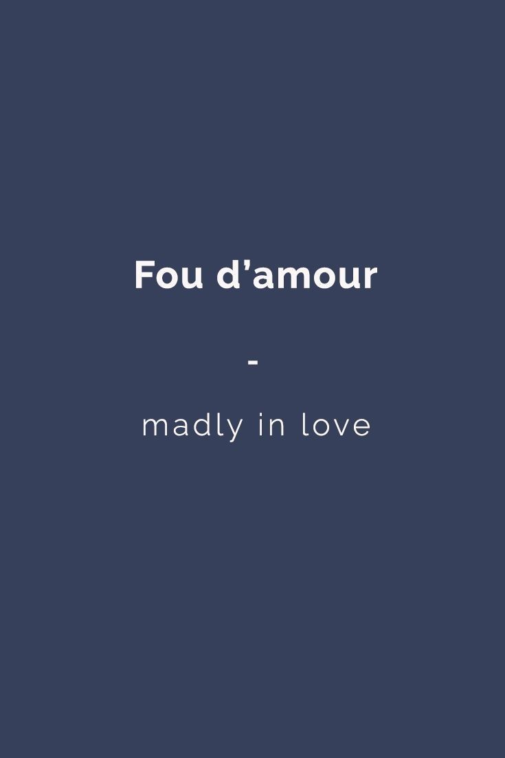 the words'fou d'amour - madly in love'on a dark blue background