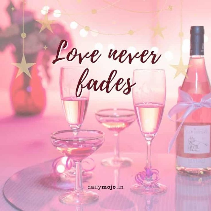 there are three glasses and two bottles of wine on this table with the words love never fadess