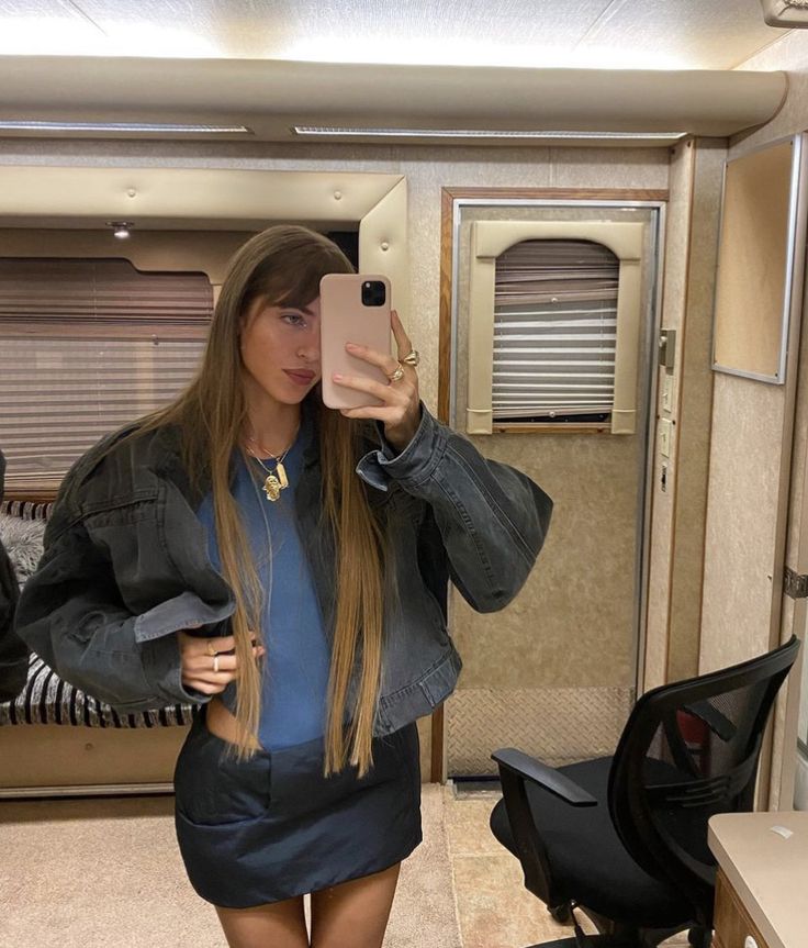 a woman taking a selfie in her rv