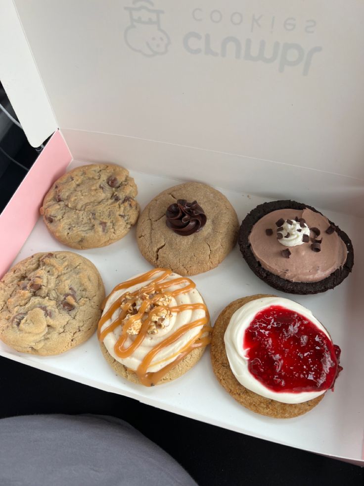 a box filled with lots of different types of cookies