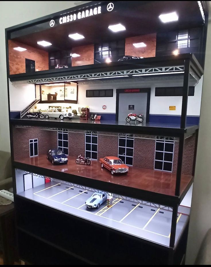 a toy model of a building with cars in it