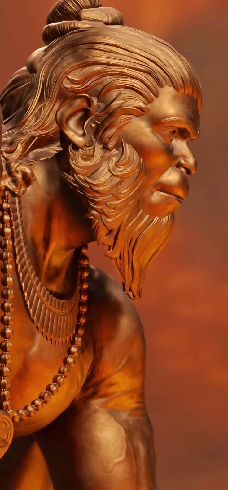 a golden statue of a man with beads around his neck