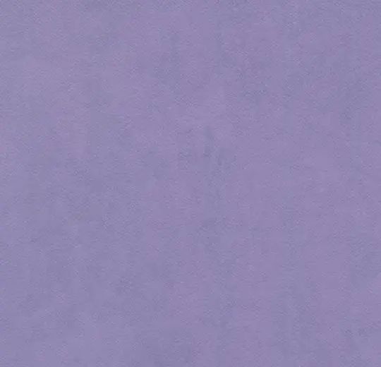 an airplane is flying in the sky on a purple background with no clouds above it