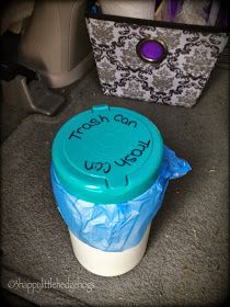 there is a plastic cup with writing on it and a blue container next to it