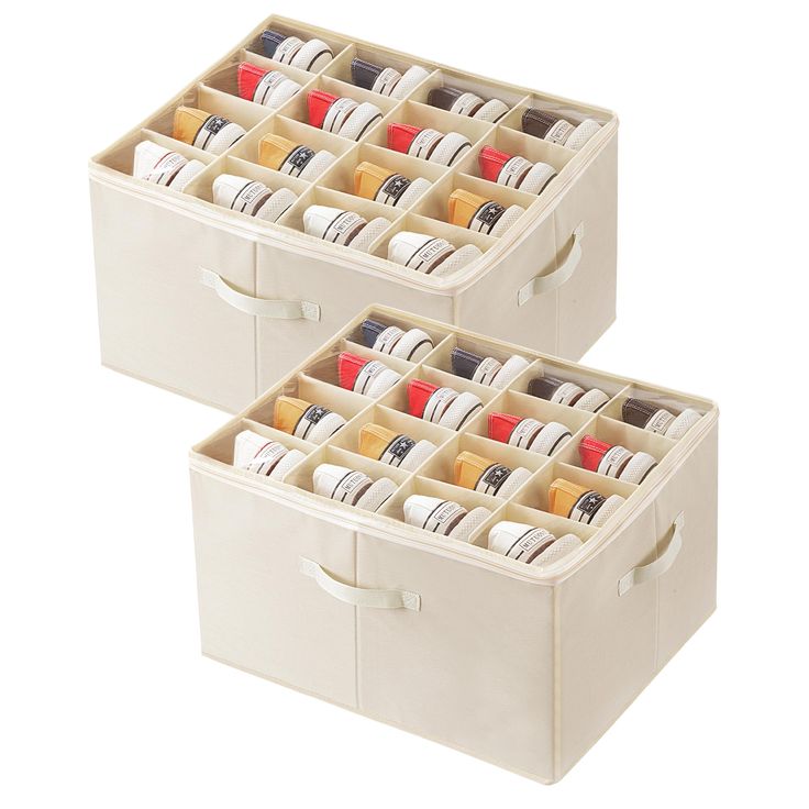 two white storage boxes filled with different colored items