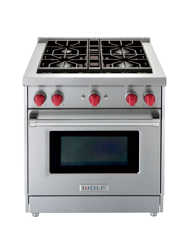 a silver stove top oven with red knobs on the front and side burners