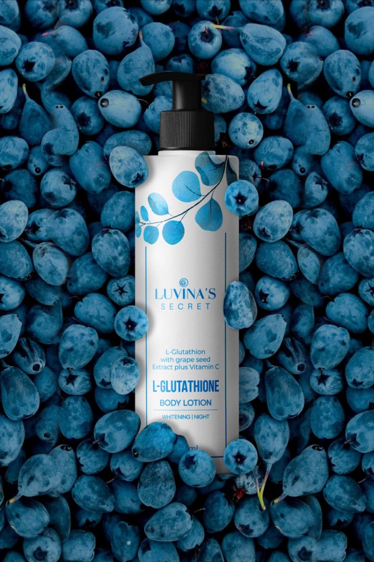 a bottle of luvia's blueberry body lotion surrounded by blueberries