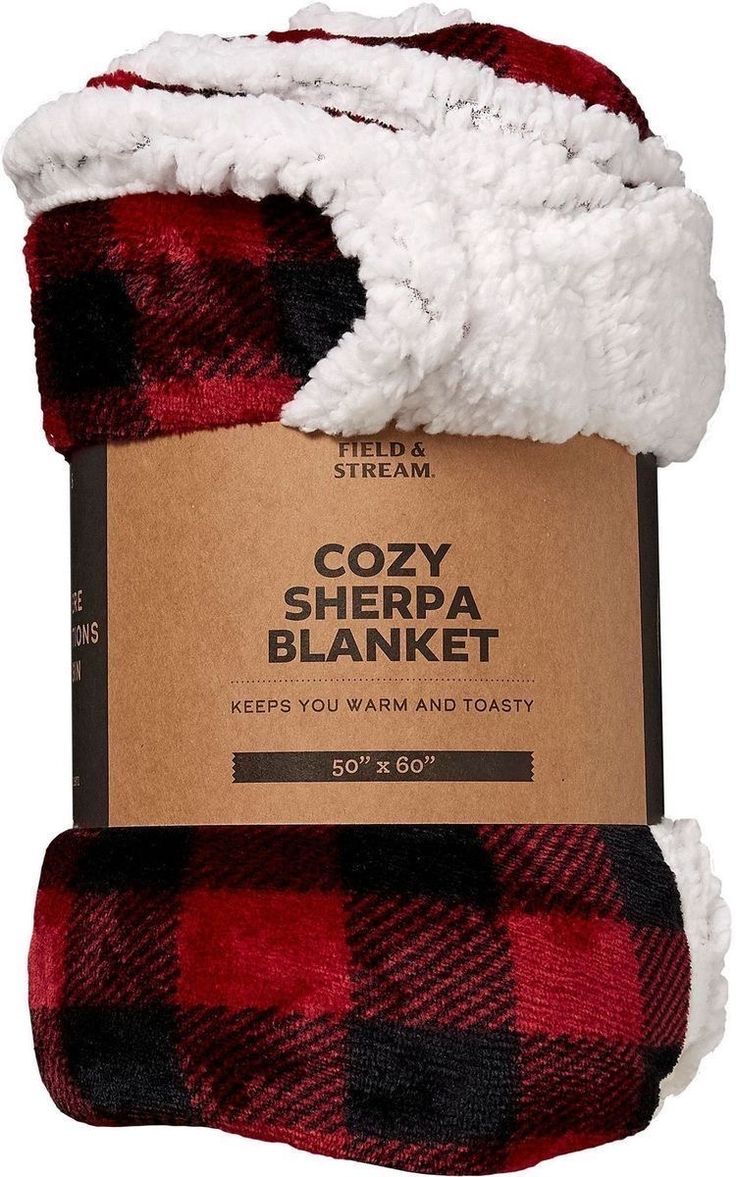 the cozy sherpa blanket is red, black and white checkered with a brown tag