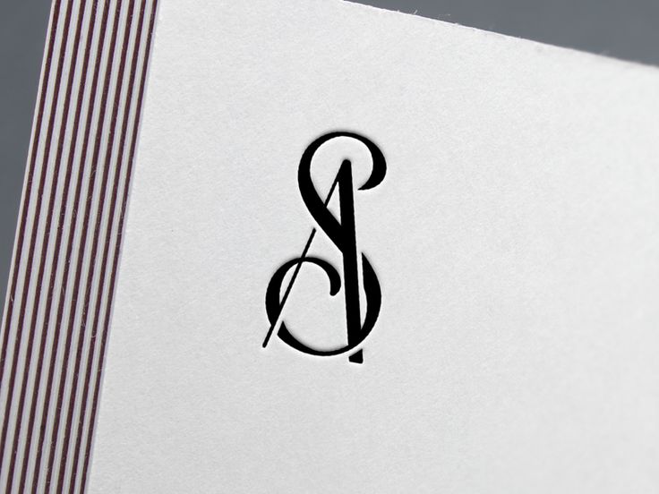 the letter b is inscribed in black on white paper