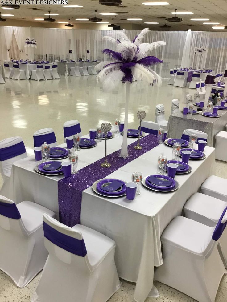 the tables are set with purple and white linens