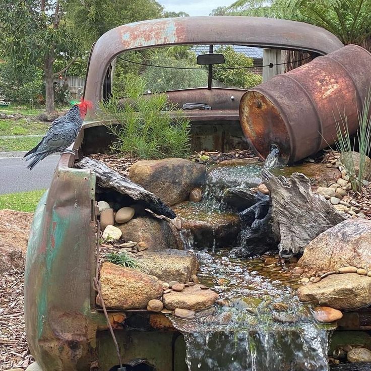 an old pick up truck is filled with water