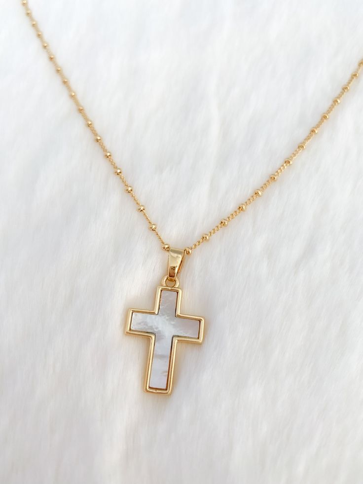 Mother of pearl cross necklace MATERIAL AND SIZE 18k gold filled chain Mother of pearl cross pedant Size pendant: 2.5cmx2cm Length chain: 45cm or 18 inches If you have questions about the product, feel free to reach me out. Don't forget to check out my other items in the store: Https://www.etsy.com/shop/nyahwithlove Gold Catholic Jewelry, Womens Cross Necklace, Christian Necklace For Women, Cute Gold Necklaces, Cute Cross Necklace, Cross Necklace Aesthetic, Jesus Jewelry, Cross Necklace Gold, Pearl Cross Necklace