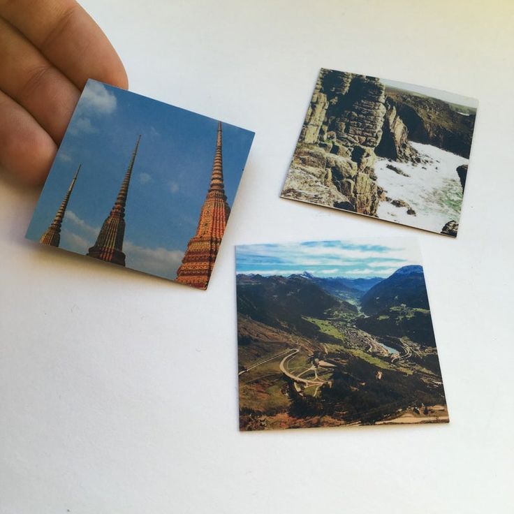 three pictures are being held up in front of a white table with a person's hand