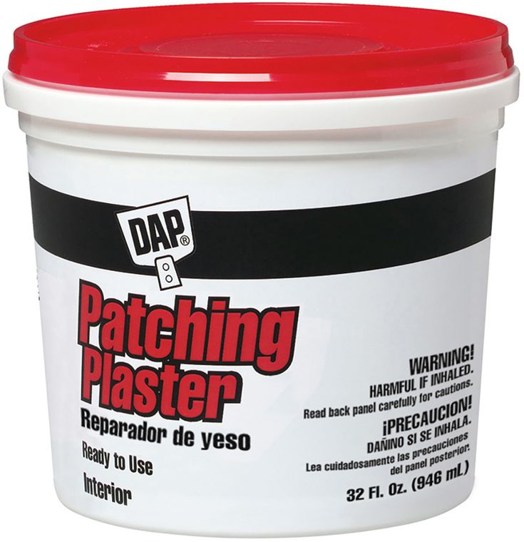 a bucket of patching paste on a white background