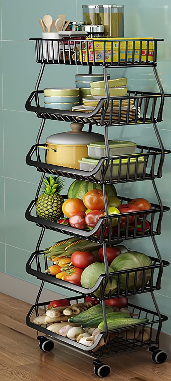 a metal rack filled with lots of food on top of a wooden floor next to a blue wall