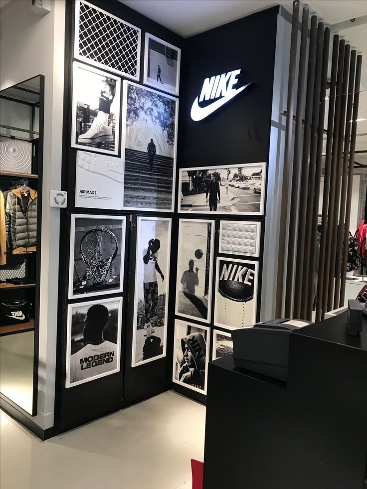 the nike store is decorated with black and white photos, posters, and other items