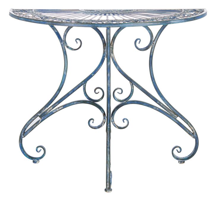 a metal table with an ornate design on it's top and bottom, against a white background