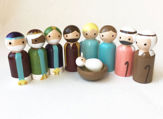 a group of small wooden figurines sitting next to each other