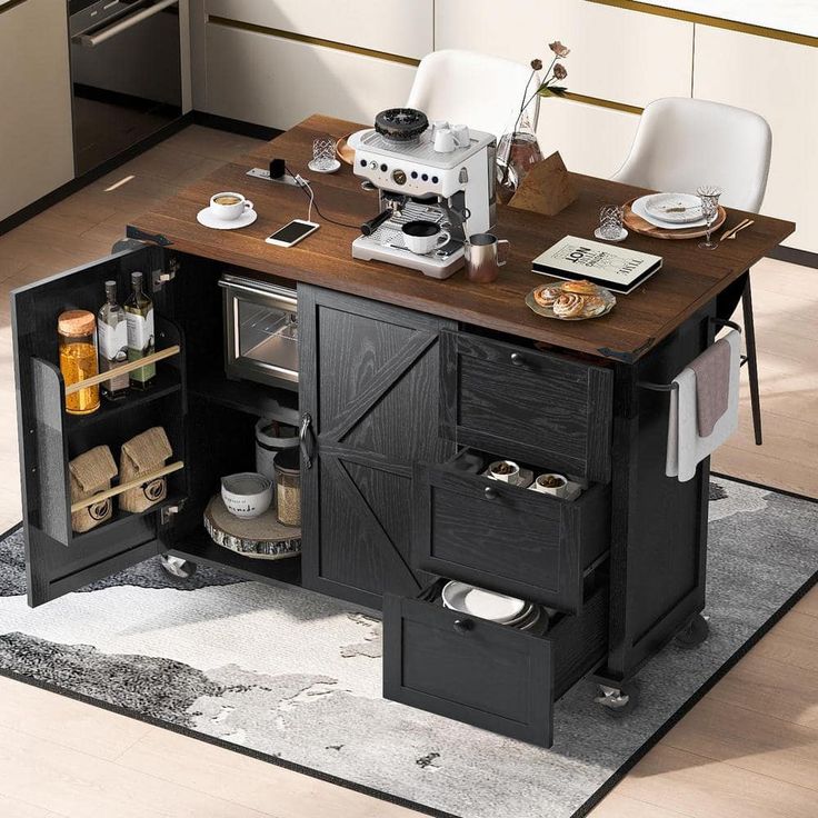 a kitchen island with an open door on the side and drawers underneath it, in front of a stove top oven