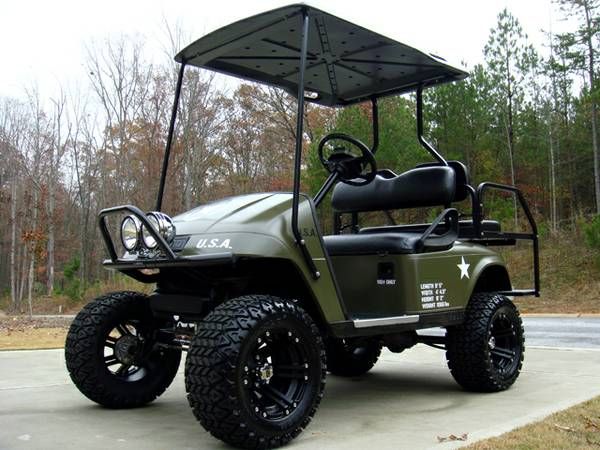 a green golf cart parked on the side of a road