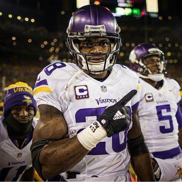 a football player is holding his fist up