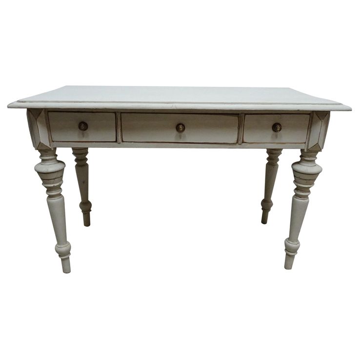 a white table with two drawers on one end and three legs on the other side