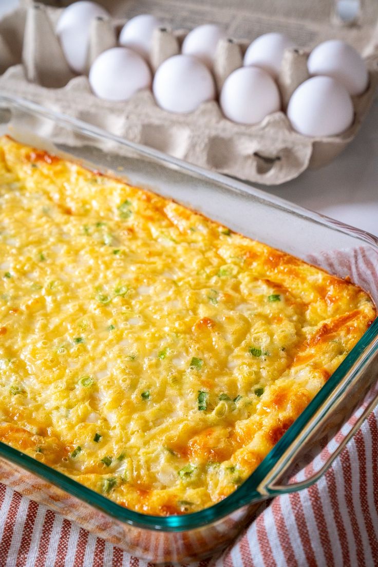 a casserole dish with eggs in the background