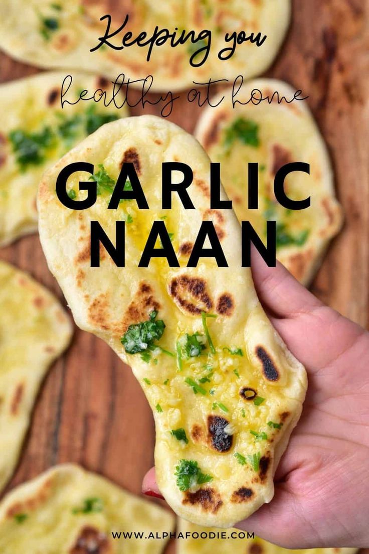 garlic naan being held up in front of the camera