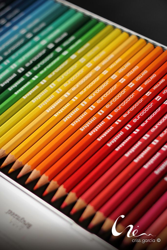 many colored pencils are lined up together