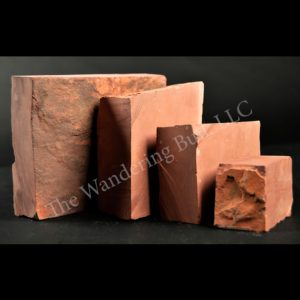 four different types of bricks stacked on top of each other in front of a black background