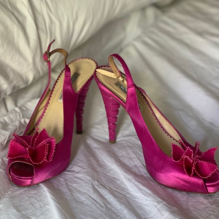 These Pumps Feature A Satin Upper, A Peep-Toe Opening, A Satin Flower Detail At The Vamp, Leather Lining And Insoles, A Sculpted Enamel Conical Heel, And Leather Soles. I Bought These One Size Too Big So The Few Times I’ve Worn Them, I Padded Them Up, Which Is Why They Look So Good. The Only Part That Looks Worn Is The Bottom. They Are Timeless Party Shoes. A Little Bit Of Steam On The Flowers Help Them Pop Like New, So Do That Before Wearing Them Out! Vintage Pink Heels For Formal Occasions, Pink Wedding Shoes For Evening In Spring, Pink Wedding Shoes For Spring Evening, Flower Heels, Satin Flowers, Flower Detail, The Vamps, Pink Satin, Party Shoes