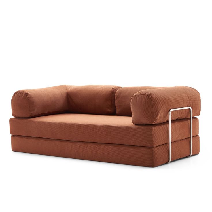 a brown couch sitting on top of a white floor